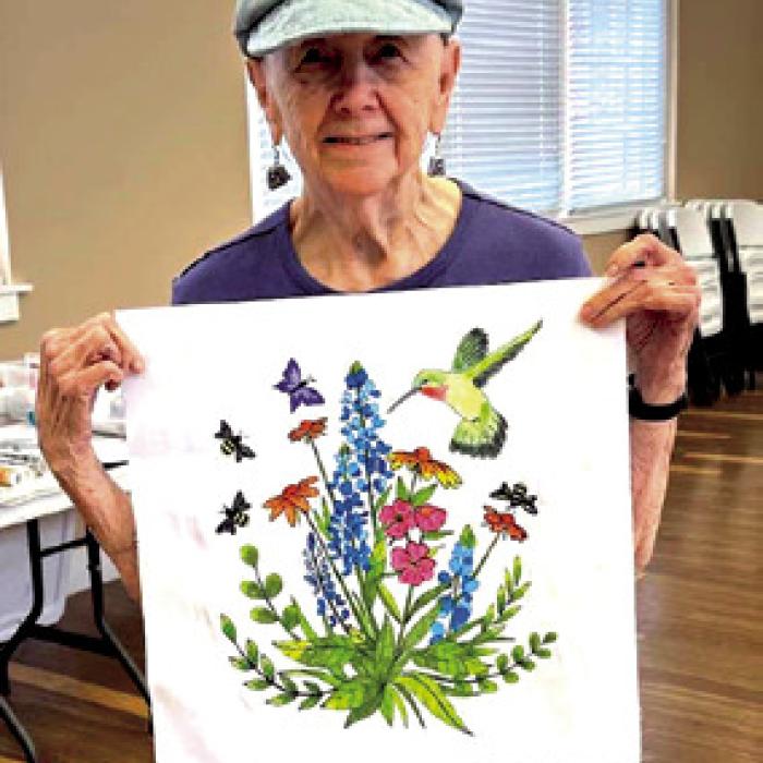 Jackie Asbill with her painted block copy.