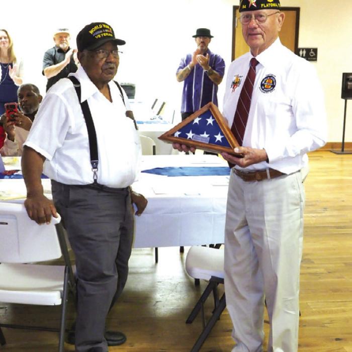 Shown here is B.J. Anderson. He is 101 and a half years old and a Veteran of World War II. He received a folded US Flag (presented by Danny Vyvjala (Commander of Post 94), along with a rousing standing ovation for being the oldest veteran present.