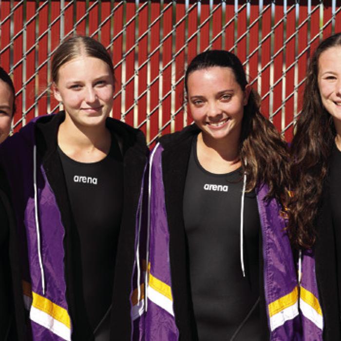 The Girls 200 Freestyle Relay team, consisting of, from left to right, Adysen Janacek, Paige Michalke, Celeine Fabre, and Eleanor Carey, made waves with a new school record of 1:56.74, besting their previous time from three weeks ago. Photo by Katy Michalke