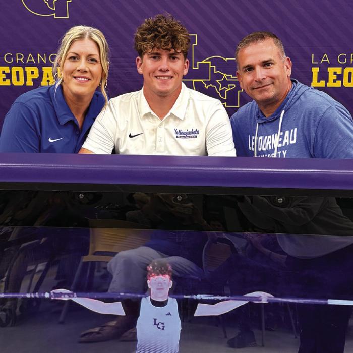 La Grange senior Cole Collier, center, inked a deal to pole vault for LeTourneau University in Longview.