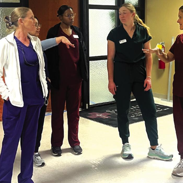 La Grange Family Health CFO Dawn Blackwell, right, walks several La Grange Family Health staffers through what will be their new clinic at the St. Mark’s Medical Office Building.