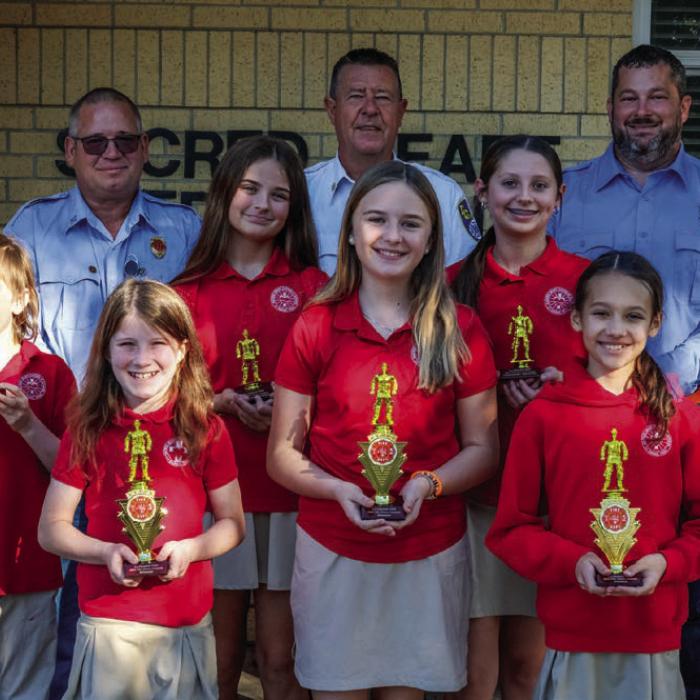 Fire poster winners from the fifth and sixth grade class at Sacred Heart School in La Grange were (front, from left) Presley Byler, Helen Streiff and Sophie Janda. Honorable mention awards went to (middle row) Dylan Elliott, Chezni Berdoll and Adalyn Emmel. Also pictured are (back) Captain Kenneth Chovanec, Fire Chief Frank Menefee and Fireman Chris Kaspar of the La Grange Volunteer Fire Department. Photos by Andy Behlen