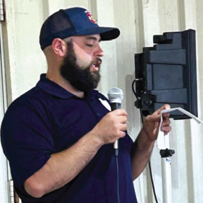 Nick Brooks from Winchester Volunteer Fire Department spoke at the Warda Neighbors Night Out.