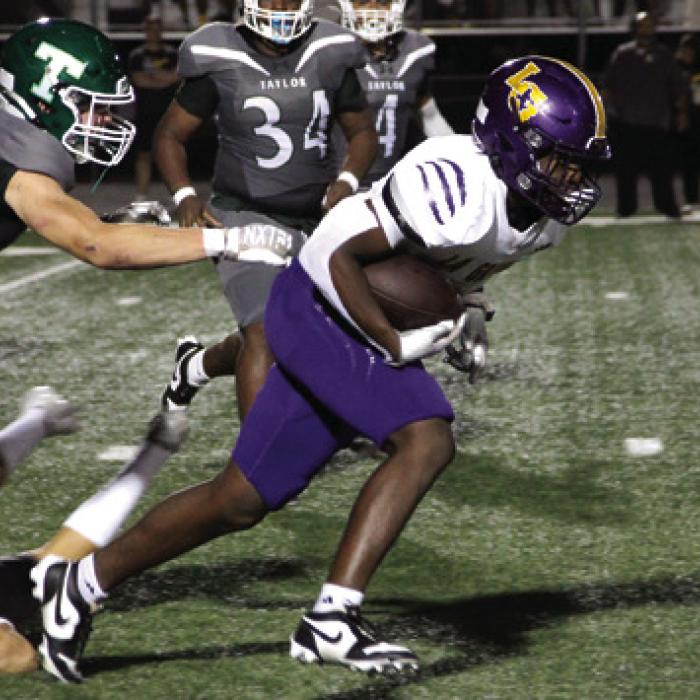 La Grange’s Dillan Johnson breaks free for yardage Friday. Photo by Hope Michalke