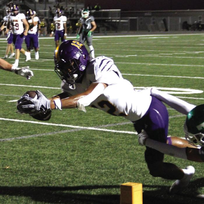 La Grange’s Dwodney Thompson dives over the goal line for La Grange’s first touchdown of the game Friday. Photo by Hope Michalke