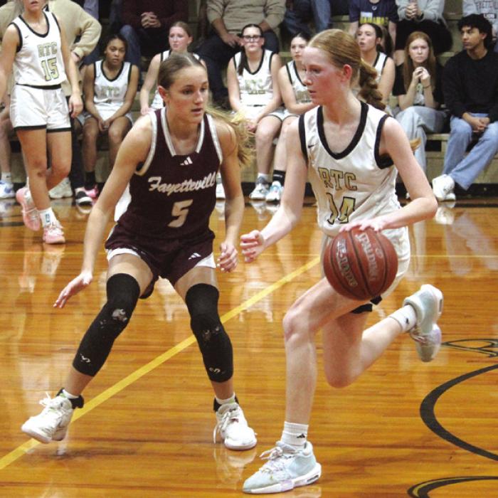 Fayetteville’s Cambree Denham, left, plays defense against Round Top-Carmine’s Morgan Nelius Friday. Photo by Jeff Wick