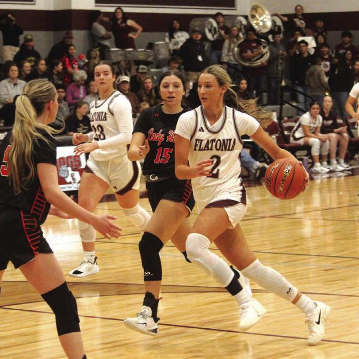 Flatonia’s Summer Sodek leads a Flatonia fast break Tuesday. Photo by Jeff Wick