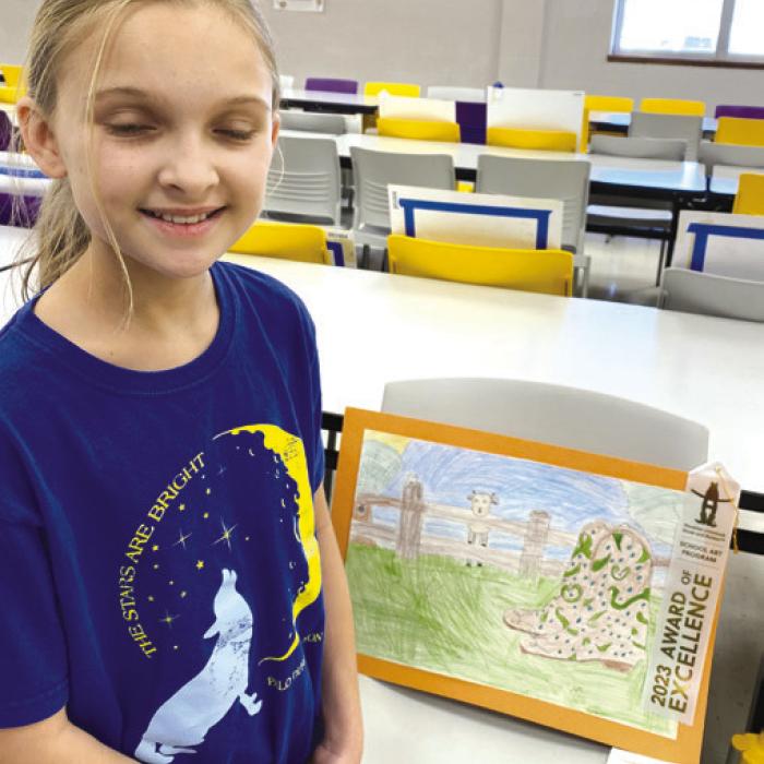 Brylee Brugger with her 3rd place artwork.