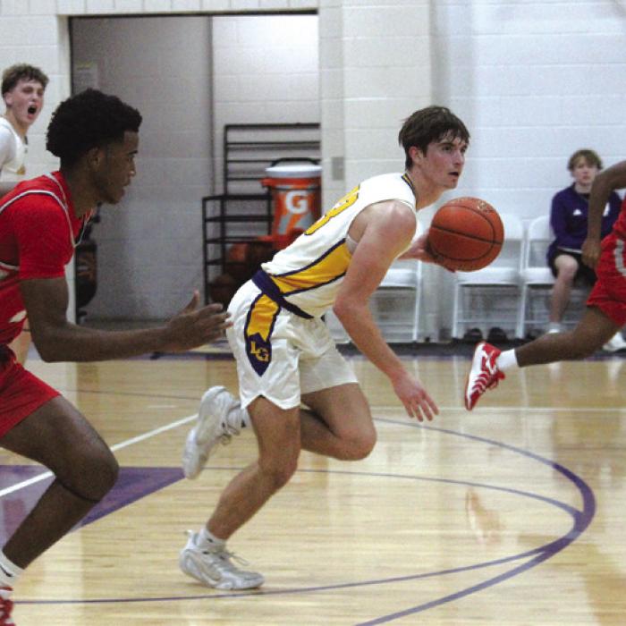 La Grange’s Mason Kleiber leads a fast-break in Tuesday’s game against Bellville. Photo by Jeff Wick