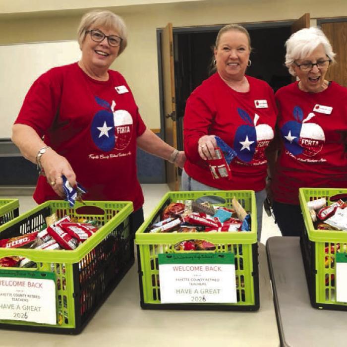 Terri Wagner, Lisa Slinkard and Carolyn McCrory prepare Goodie Baskets for educators.