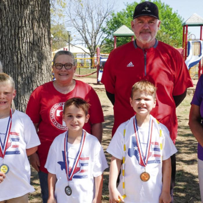 Winners of the boys division at Sacred Heart School were (front, from left) Luke Bienek-1st Place, Jack Wied-2nd Place, and Landon Muzny-3rd Place. Also pictured are Karen Forest of Fayette County helpers, second grade teacher Carolyn Weishuhn, P.E. coach David Wicke and La Grange Mayor Jan Dockery.