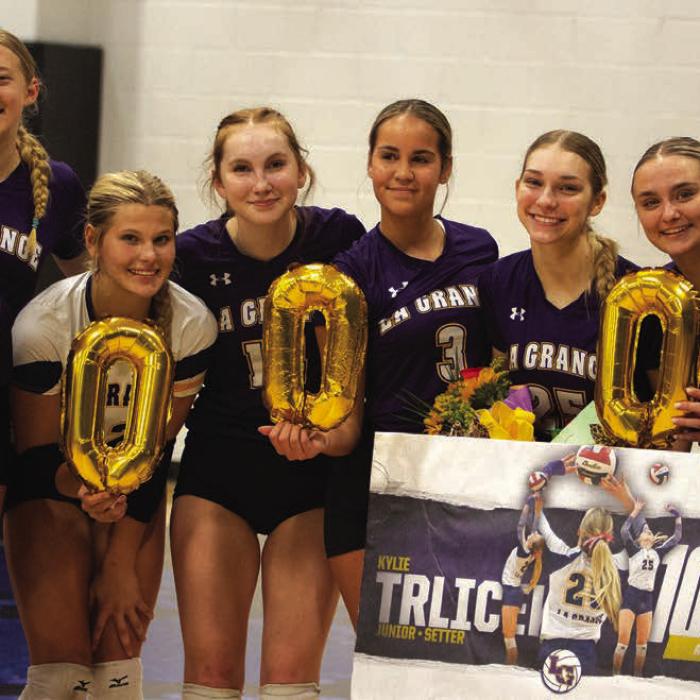 La Grange junior volleyball setter Kylie Trlicek recorded her 1,000th career assist last week in the Lady Leps’ regular season finale victory over Navasota. Trlicek, holding the flowers, is shown here celebrating with her teammates after that win. The Lady Leps face Sealy in the first round of the playoffs Monday at 6 p.m. at Rice Consolidated. Photo by Gabby Castillo