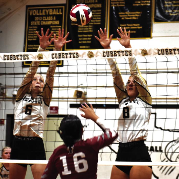 Round Top-Carmine’s Cayden Nelius and Bree Dooley jump to block this hit by Fayetteville’s Devynn Moeckel. Photo by Paul Kipp
