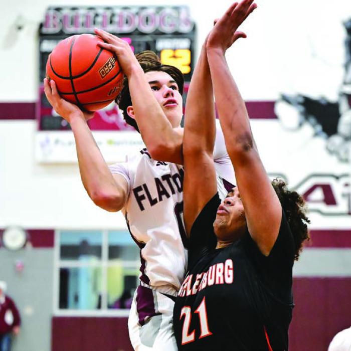 Flatonia’s Beck Zimmerman drives to the basket against the defense of Schulenburg’s Jayvan Luhrs Tuesday. Photo by Stephanie Steinhauser