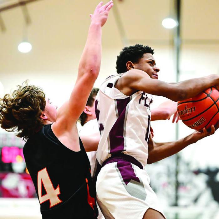 Flatonia’s Jaylon Anderson in action Tuesday against the defense of Schulenburg’s Jayse Janda. Photo by Stephanie Steinhauser