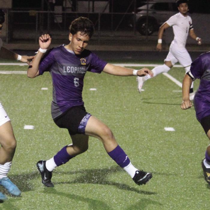 La Grange’s Nohe Maldonado, center, and Raul Macera, 10, try to stop this Cameron advance in Tuesday’s game. Photo by Jeff Wick