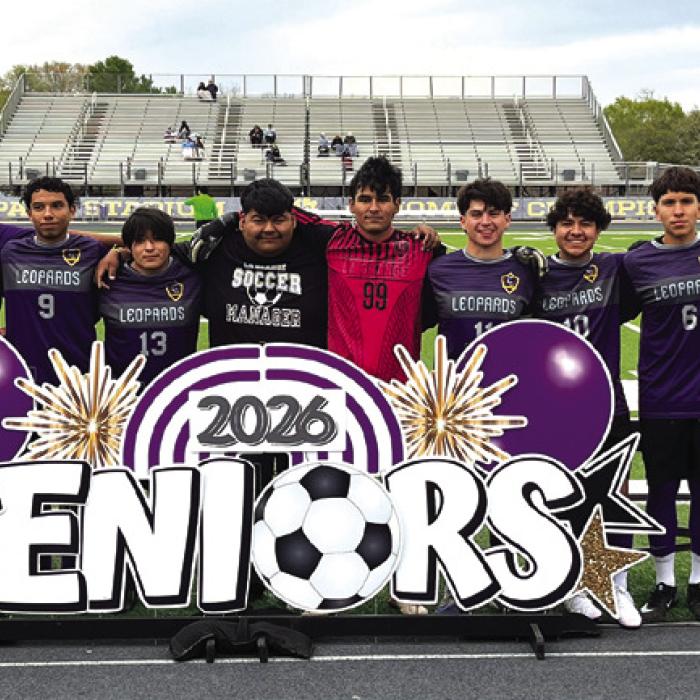 The senior members of the La Grange girls soccer team, left, and the boys soccer team, right, pose during Senior Night festivities at Leopard Stadium Monday. Photos by Jeff Wick