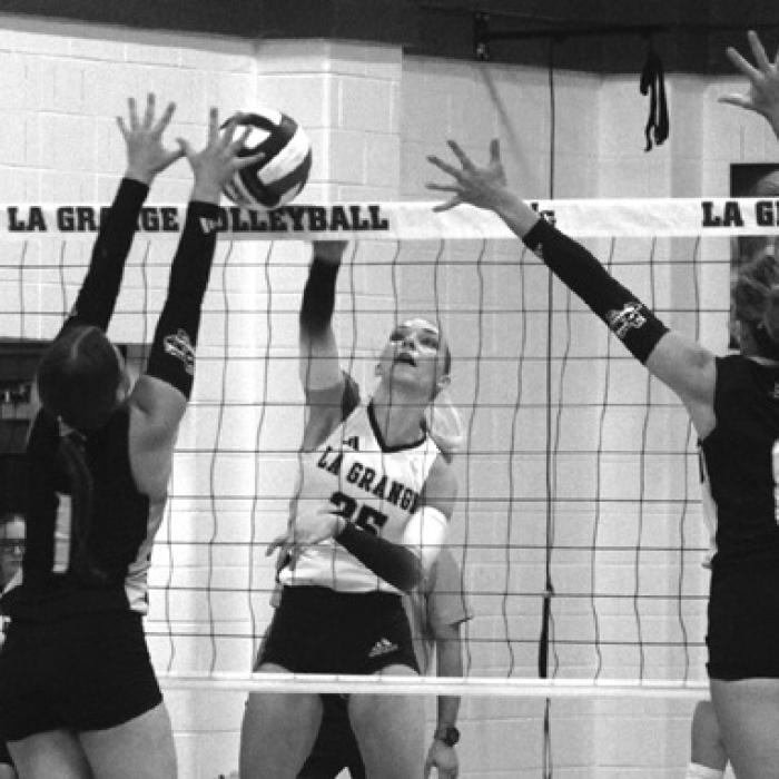 La Grange’s Kylie Trlicek spikes the ball through a pair of Sealy blockers Friday. The Lady Leps beat Weimar Tuesday in five sets to improve to 18-11. Photo by Jeff Wick