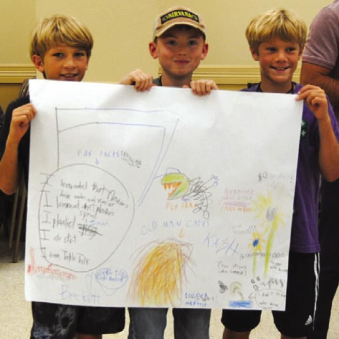 Beckett Samples, Kash Alberthal and Lennox Samples display their art work.