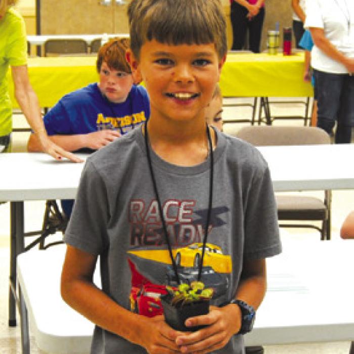 Daniel Walker takes home a Venus Fly Trap plant.