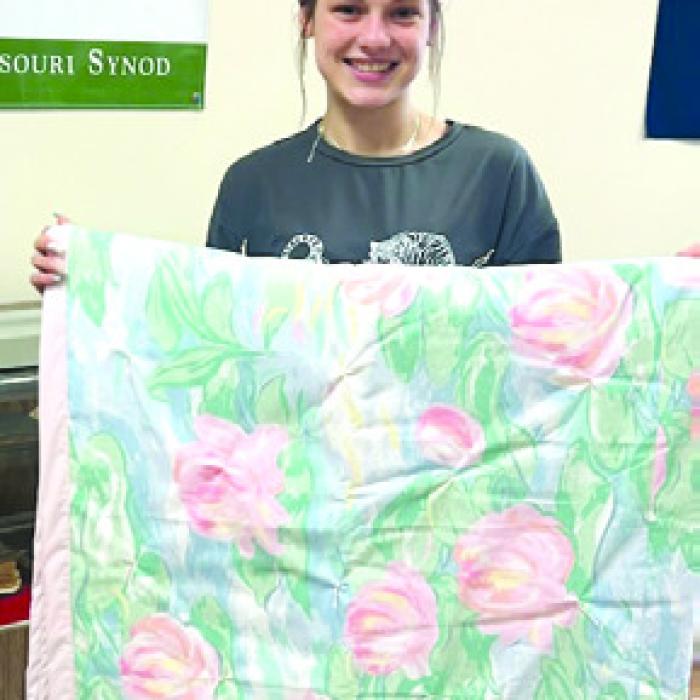 Graduate shown with her quilt is Ashton Grimm. Not pictured, but receiving quilts are: Giddings Graduate Andrew Davis and Madisonville High graduate Vernon Smith IV.