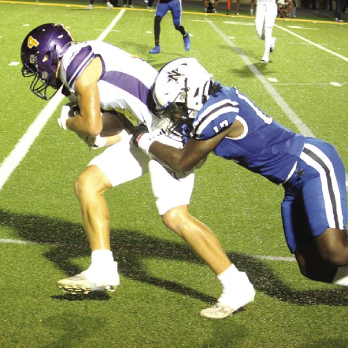 La Grange’s Eli Gillum drags a Navasota player along with him on his way to a second quarter touchdown Friday. Photos by Jeff Wick