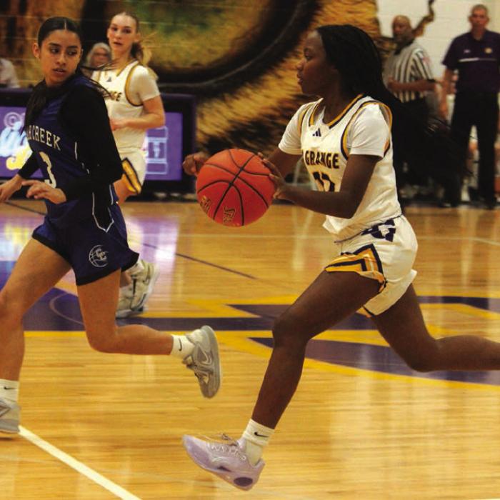 La Grange’s Kaylee Holmes leads a fast break down the court during Tuesday’s victory over Cedar Creek. Photo by Jeff Wick