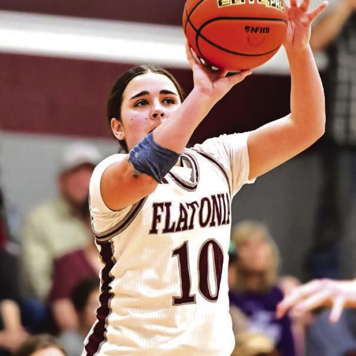 Freshman Kennedy Dornak sinks a three point shot for Flatonia in Friday’s victory. Photo by Stephanie Steinhauser