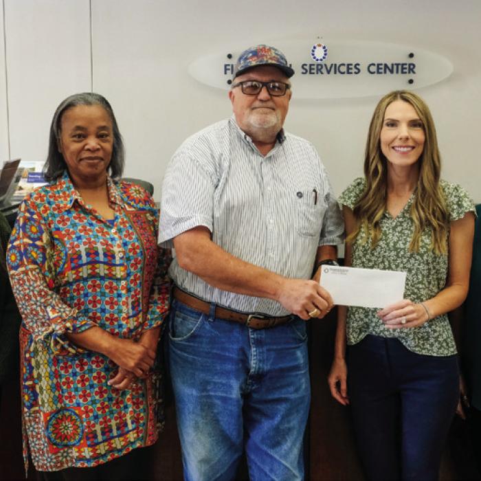 Prosperity Bank in La Grange recently presented a donation to the Texas Ramp Project. Pictured are (from left) Lending Assistant Lily Rios, Banking Center Manager Peggy Pol, Texas Ramp Project Regional Coordinator J. Frank Smith, Vice President Ashley Firkins and Banking Officer Barbara Janacek. Staff photo by Andy Behlen