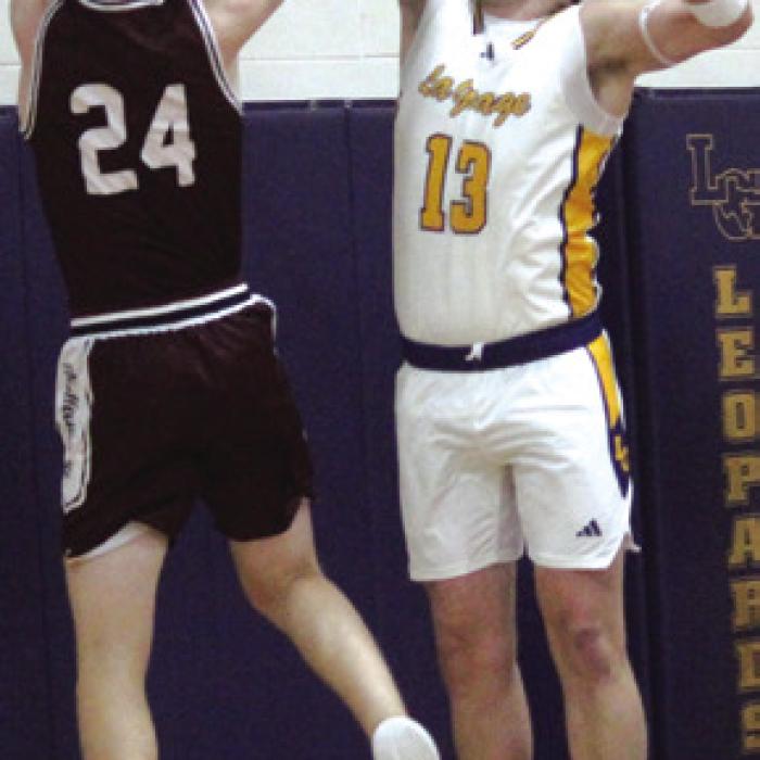 La Grange’s Conner Brooks plays defense Tuesday. He also scored a game-high 31 points. Photo by Jeff Wick