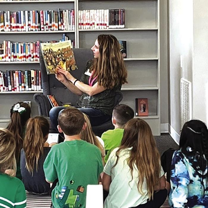 JP Jamie Moreau reading to 3rd graders as part of the Read Across America event in Fayetteville.