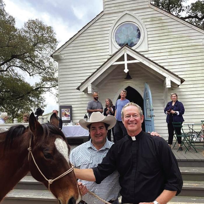 William “Father Bill” Miller, one of St. Cecilia’s founders and pastor is shown here, right, during the Blessing of the Animals event last year at the church.