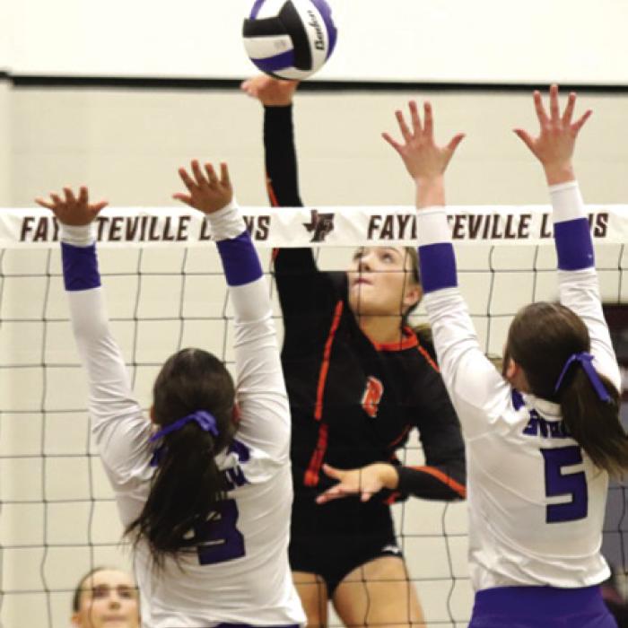 Schulenburg’s Reagan Dusek, left, and Greenli Van Zandt right, spiked their way to a playoff victory Tuesday in Fayetteville. Photo by Audrey Kristynik