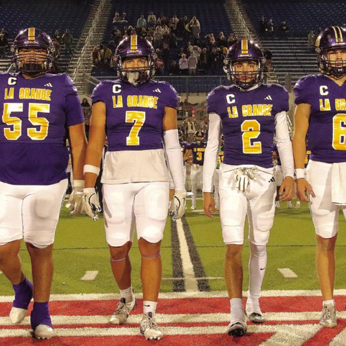 The La Grange captains walk to midfield for the coin toss at the start of Friday’s game, left to right: Javier Cuevas, Devonte McKenzie, Max Dixon and Clayton Cooper. Photo by Darrell D. Gest