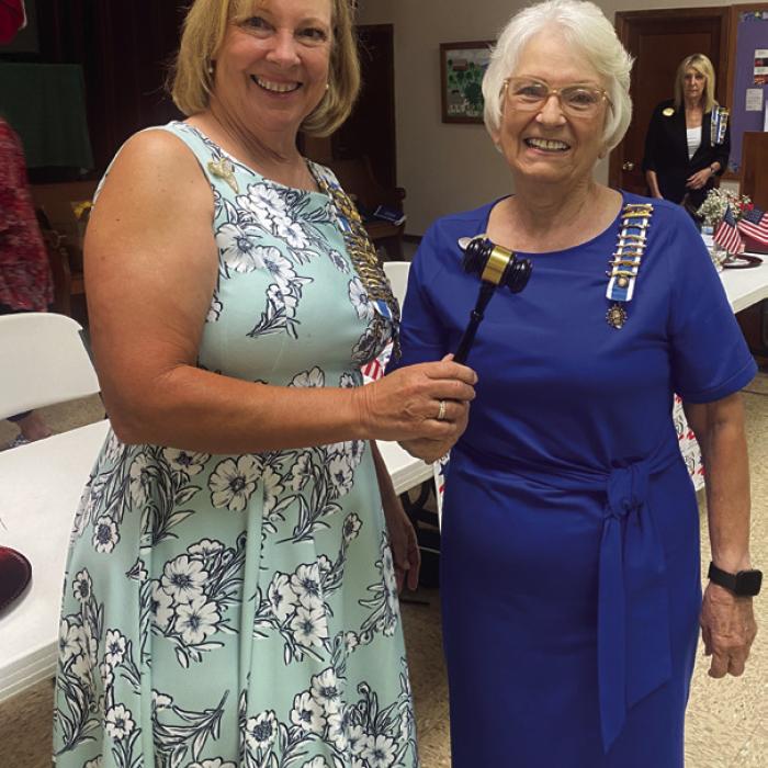 Regent Carolyn Caflisch, right, passes on the Gavel and Regent’s Pin to Regent-Elect, Gina Minzenmeyer.