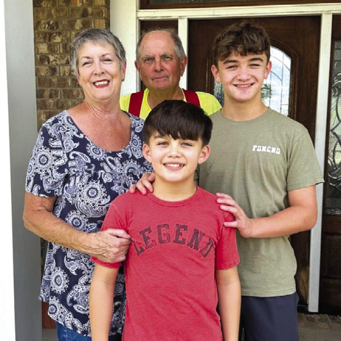 Kathy and Frank Chlumsky and their grandsons Conner and Hunter.