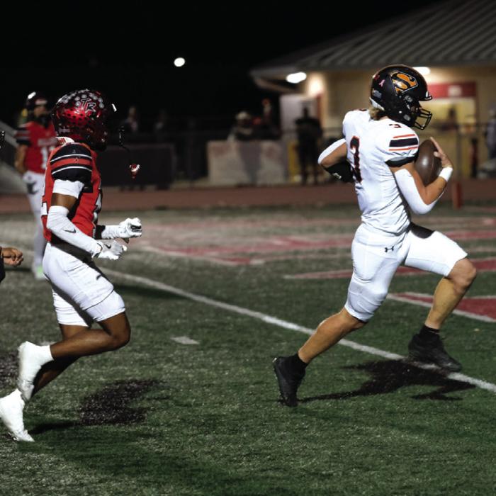 Schulenburg quarterback Aaron Janecek crosses the goal line on a keeper. Photo by Andy Behlen