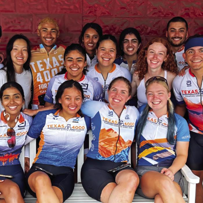 The 18 University of Texas riders in front of the Red &amp; White Inn and Gallery.