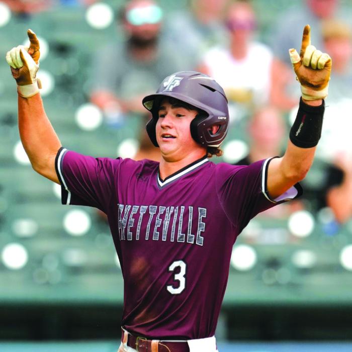 Fayetteville’s Lawson Fritsch celebrates after scoring a run in Saturday’s title game. Photo by Scott Coleman