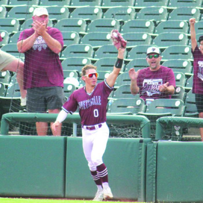 Fans celebrate after Fayetteville second baseman Jack Winford made a nice catch in foul territory early in Saturday’s game. Photo by Jeff Wick