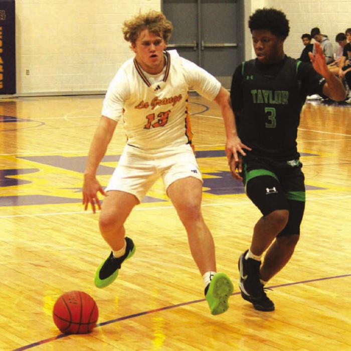 La Grange’s Conner Brooks drives to the basket in Tuesday’s win over Taylor. Photo by Jeff Wick