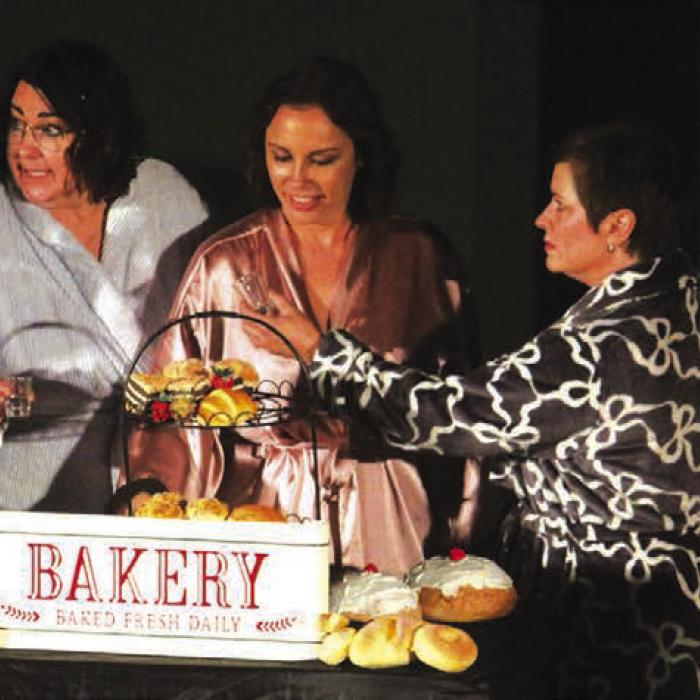 Some of the stars of “Calendar Girls” get some liquid courage in a scene before their calendar shoot. Left to right: Julie Couch, Lucy Carr, Staci Ulrich, Blythe Cone and Katy Beauford.