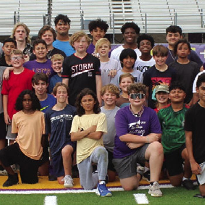 Last week an after-school 7-on-7 football league for 5th and 6th graders, coached by current Leopard high school football players, began at Leopard Stadium. Here are the campers during a break in the action. The camp concludes this week. Photo by Jeff Wick