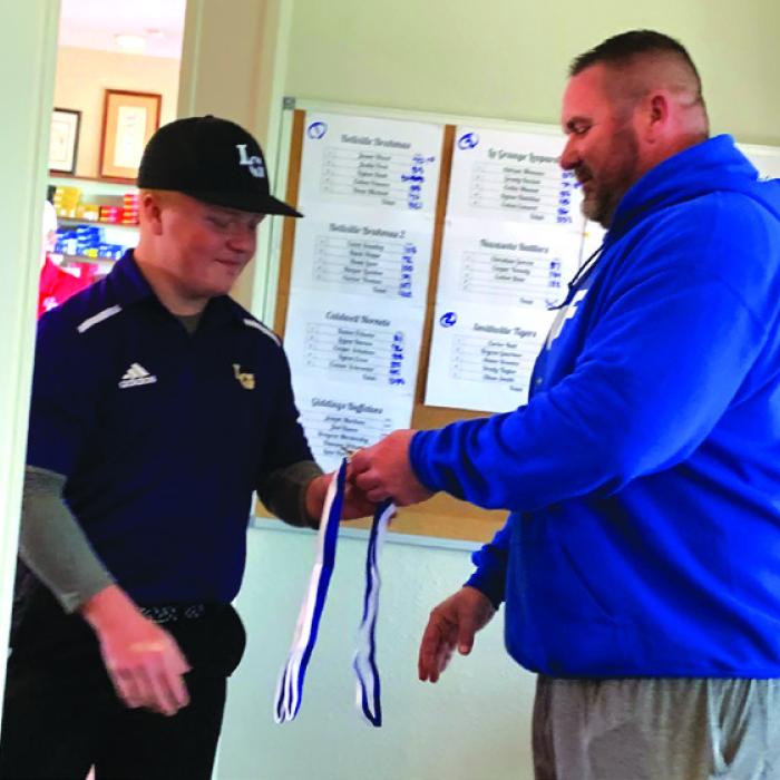 La Grange’s Grady Kocian receiving his 3rd place medal.