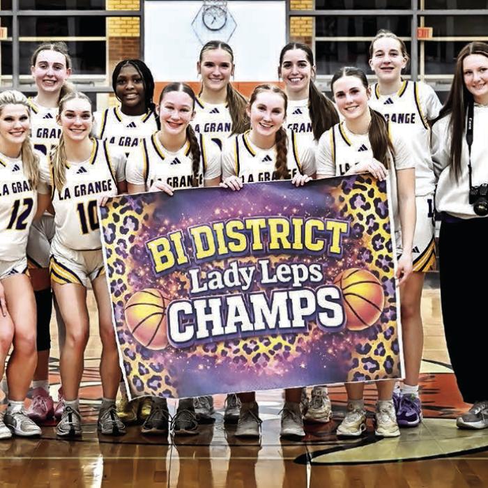 The members of the La Grange girls basketball team celebrate after winning Tuesday’s playoff opener. Photo by Stephanie Steinhauser
