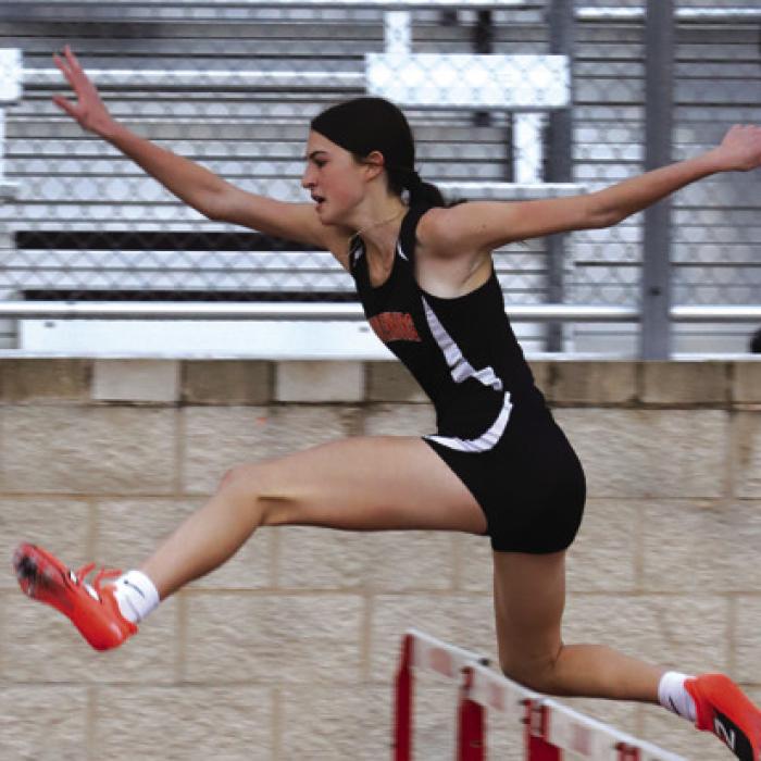 Schulenburg’s Eva Faith competes in the 100 meter hurdles at the Columbus meet. She was 4th. Photos by Audrey Kristynik