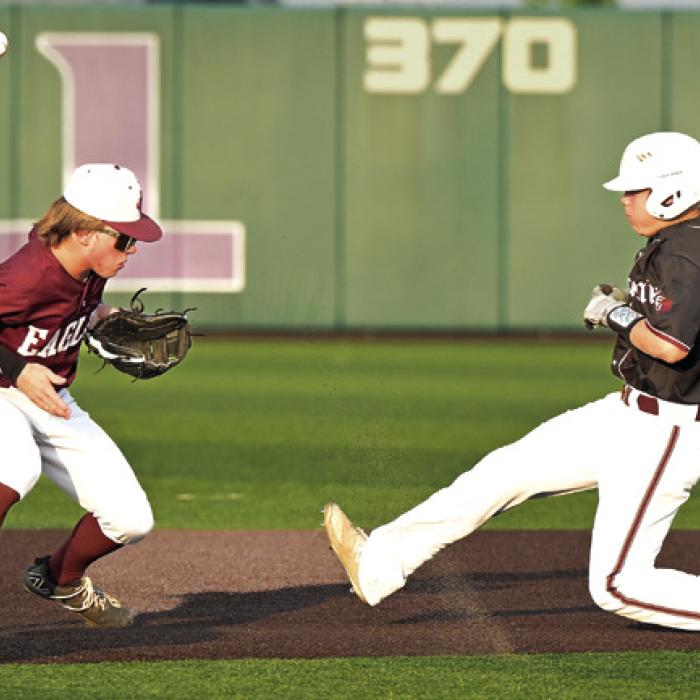 Nathan Aguillon is safe at 2nd base when Johnson City 2nd baseman mishandles the throw from the catcher. Aguillon would then steal third and make it home on a bad throw to score the first run of the game for The Flatonia Bulldogs. Photo by Stephanie Steinhauser