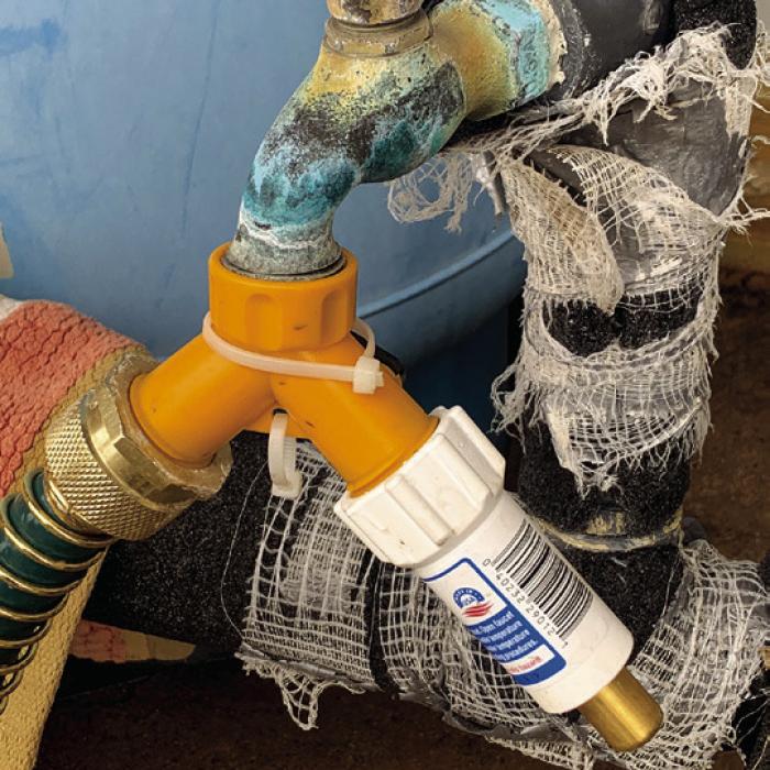 A Freeze Miser attached to one side of a “Y” adaptor allows a water hose to remain hooked up to the faucet while providing freeze protection.