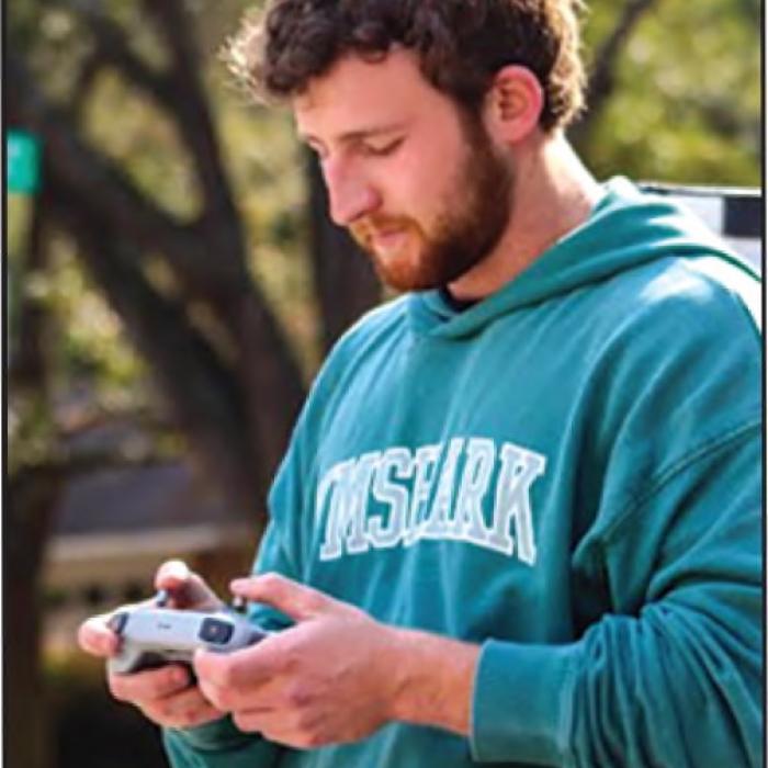 Lane Fritsch at the controls of his drone.