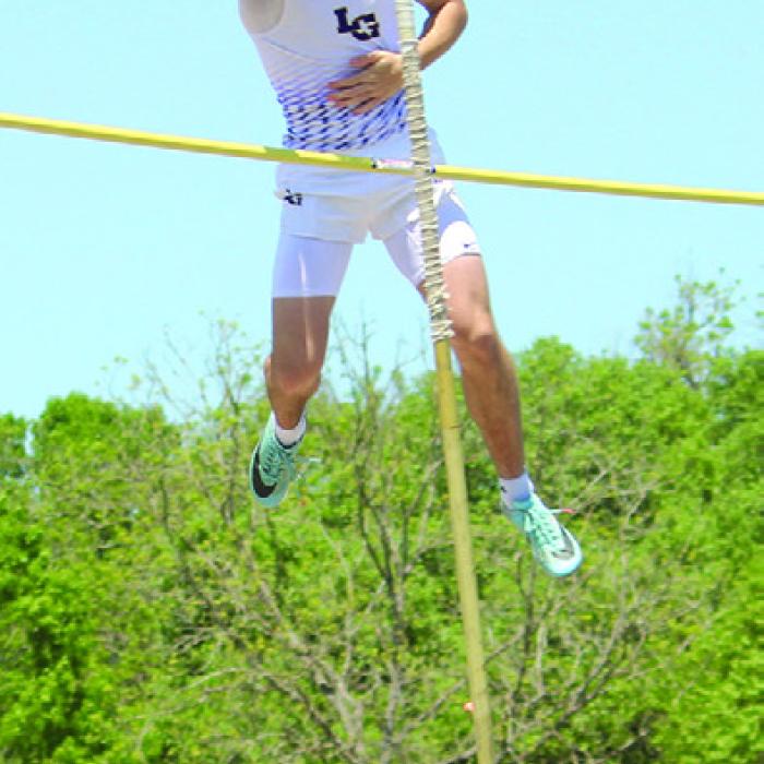 Three images of Cordale Knapik pole vaulting at the area meet– left focusing, center bending the pole and right, flying over the bar. Photos by Jeff Wick